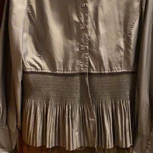 Women’s pleated, grey blouse.